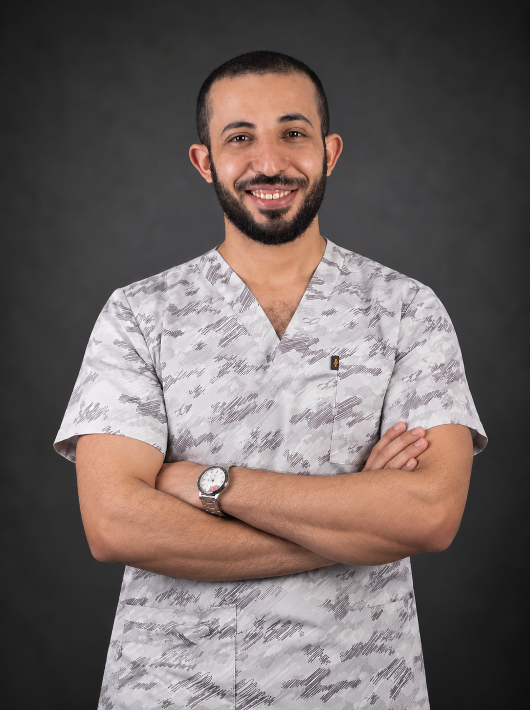 Smiling Doctor in Patterned Scrubs 2